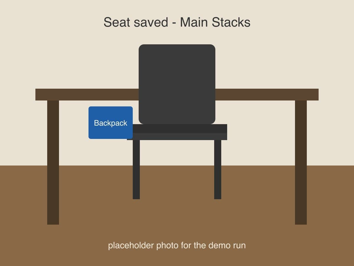 The helper's photo: a seat at Main Stacks with a blue backpack on it.